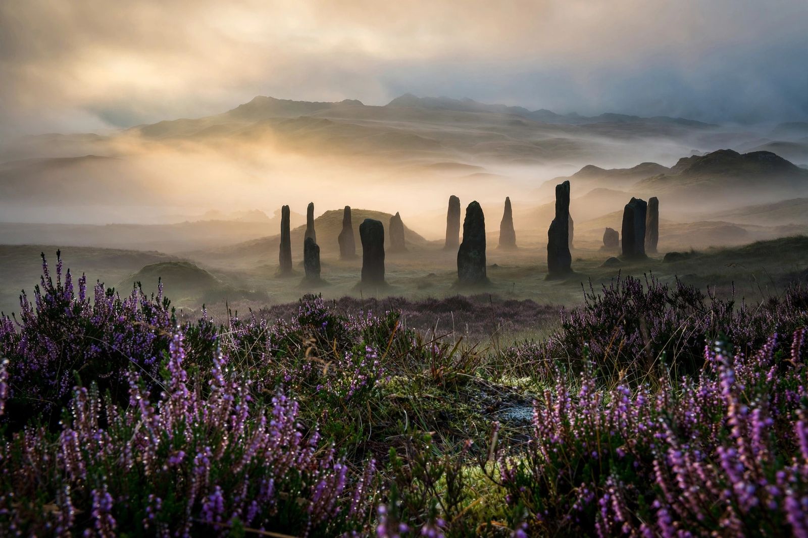 Ancient standing stones in the misty Scottish Highlands at dawn — best time-travel romance books